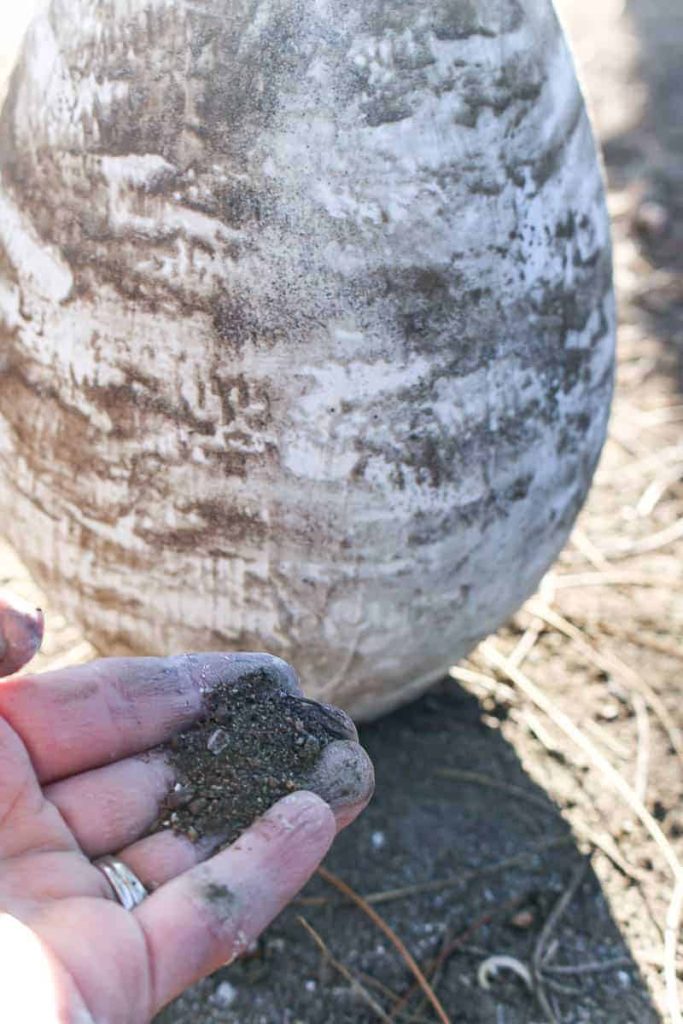 To give this vase a rustic stoneware look, add another layer of joint compound and fine, sandy dirt.