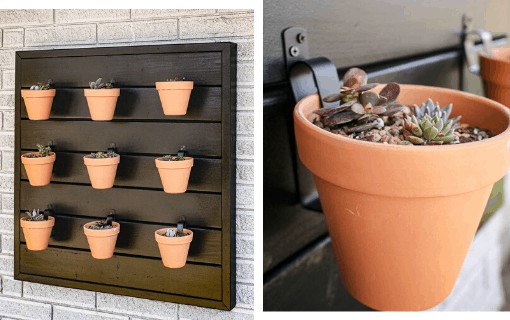 Our hanging wood planter wall, complete with nine terra cotta planters. We used the paint sprayer to complete this outdoor wood painting project.