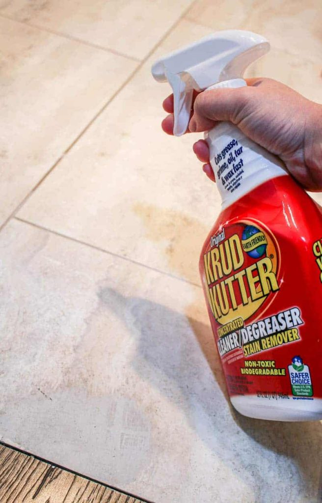 Before stenciling floor tiles, you want to make sure it's clean from grime and dirt. We used Krud Kutter to clean our tile floors