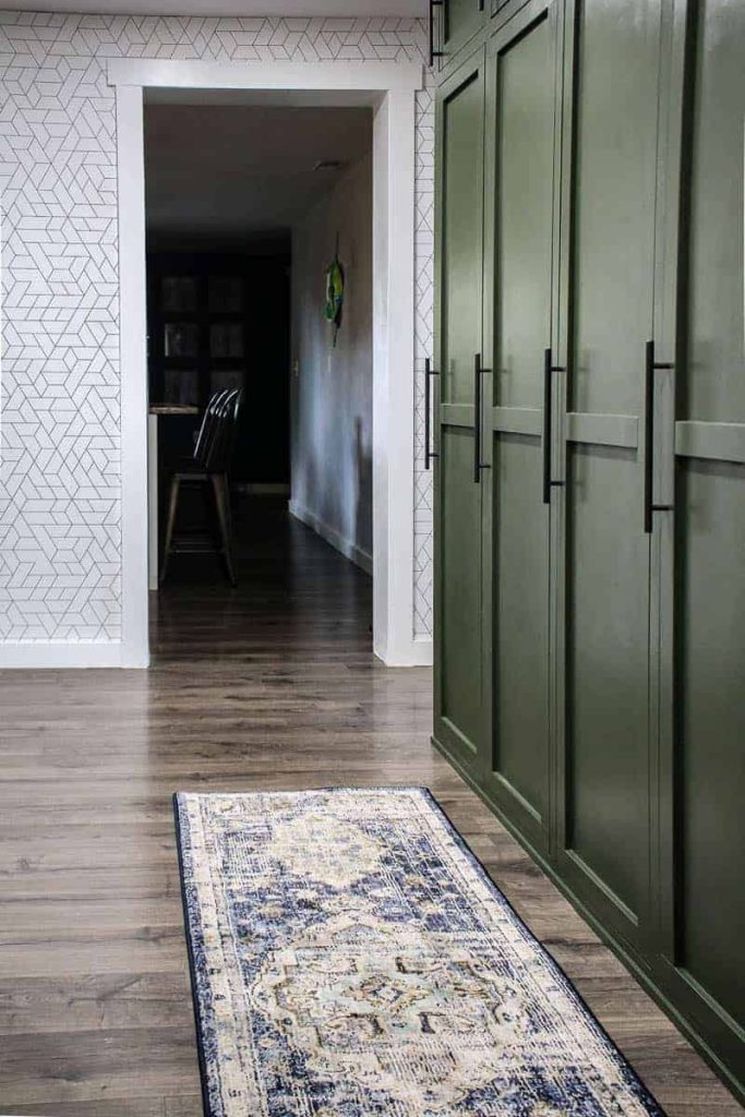 A look at our new bohemian runner rug in our mudroom, next to the forest green mudroom lockers.