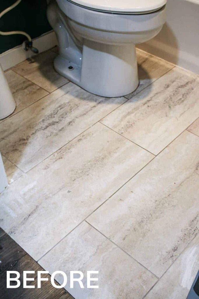 Outdated and cheap tan tile flooring in an old guest bathroom in need of new stenciling floor tiles