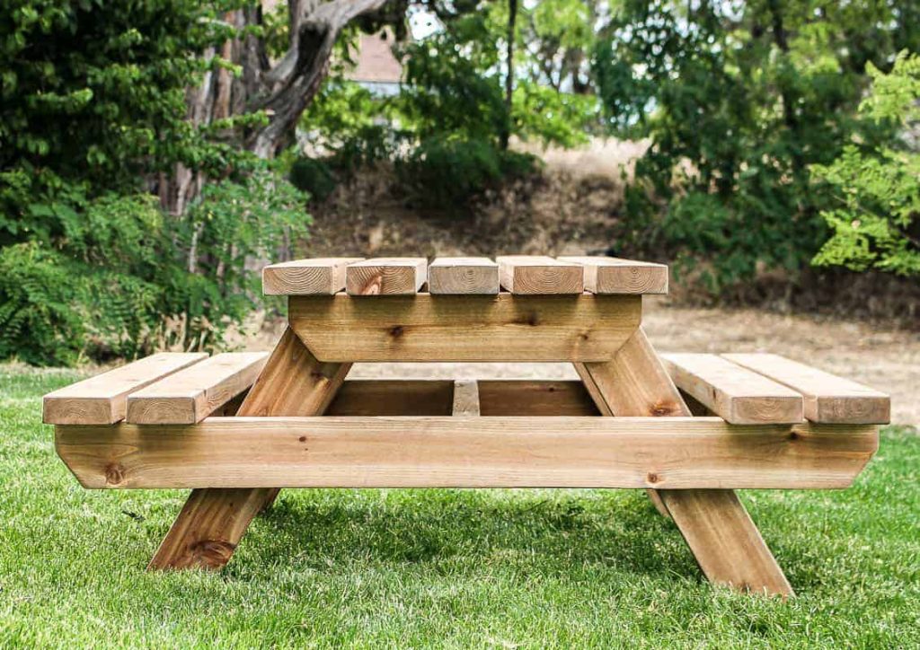 This adorable toddler sized picnic table is the perfect addition to a family backyard