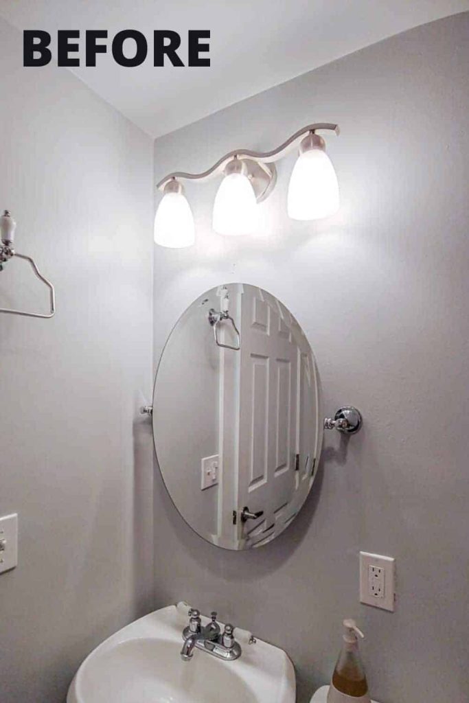 A look at our guest bathroom vanity - a free standing sink and oval wall mounted mirror.