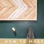 Arrow pattern wall art made with wood shims and scrap wood hanging on wall in bathroom with text overlay that says how to make wood shim wall art