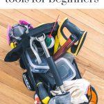 shows a tool bag filled with various tools on a wood floor with overlay text that says woodworking tools for beginners