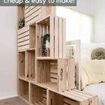 shows a side view of the 10 wood crate bookshelf stacked on each other with plants next to a bed with over lay text that says crate shelves cheap and easy to make