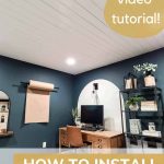 Home office with wood desk, painted arch shape on wall and white shiplap planked ceiling with text overlay that says video tutorial how to install a shiplap ceiling