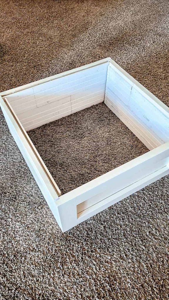 shows the shiplap put together to make the Christmas tree box stand