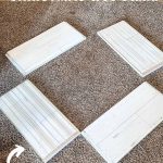 shows pieces of laid out shiplap with overlay text that says how to make a Christmas tree stand and stores flat