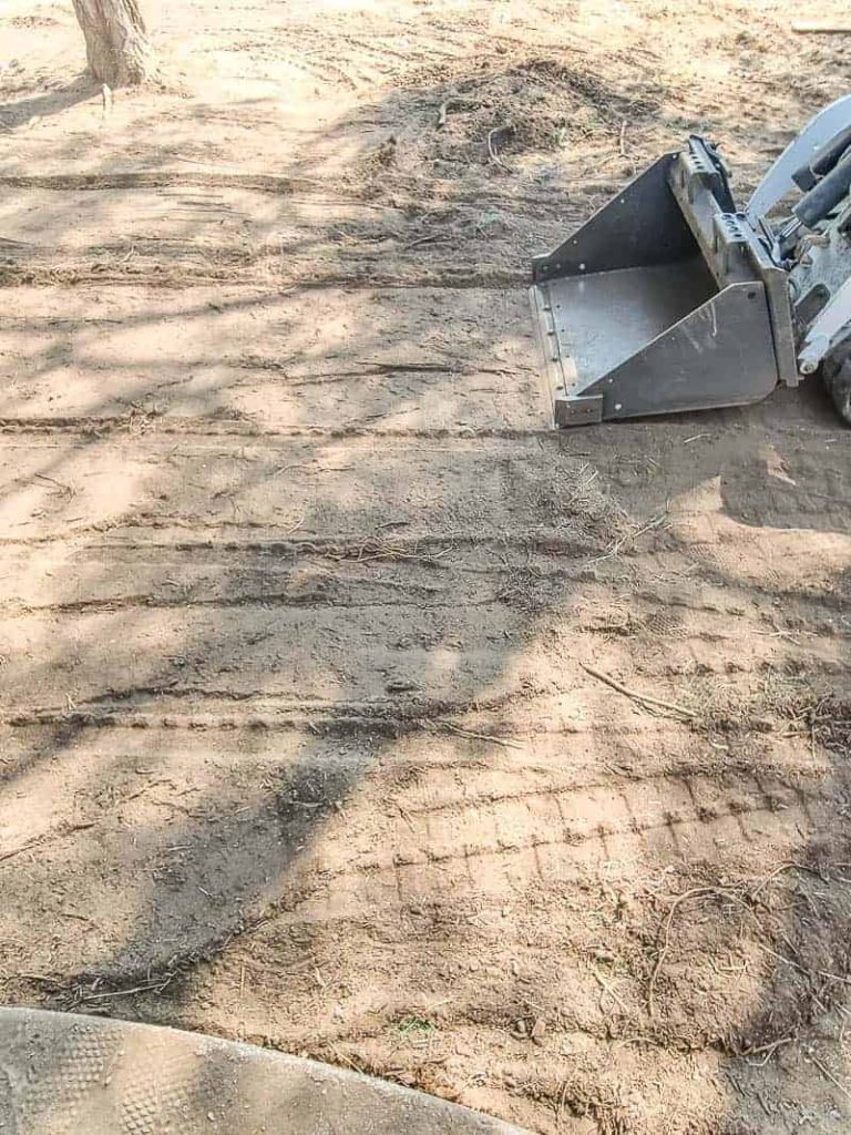 We used this mini track loader (may also be called mini skid steer) all weekend to level out the backyard