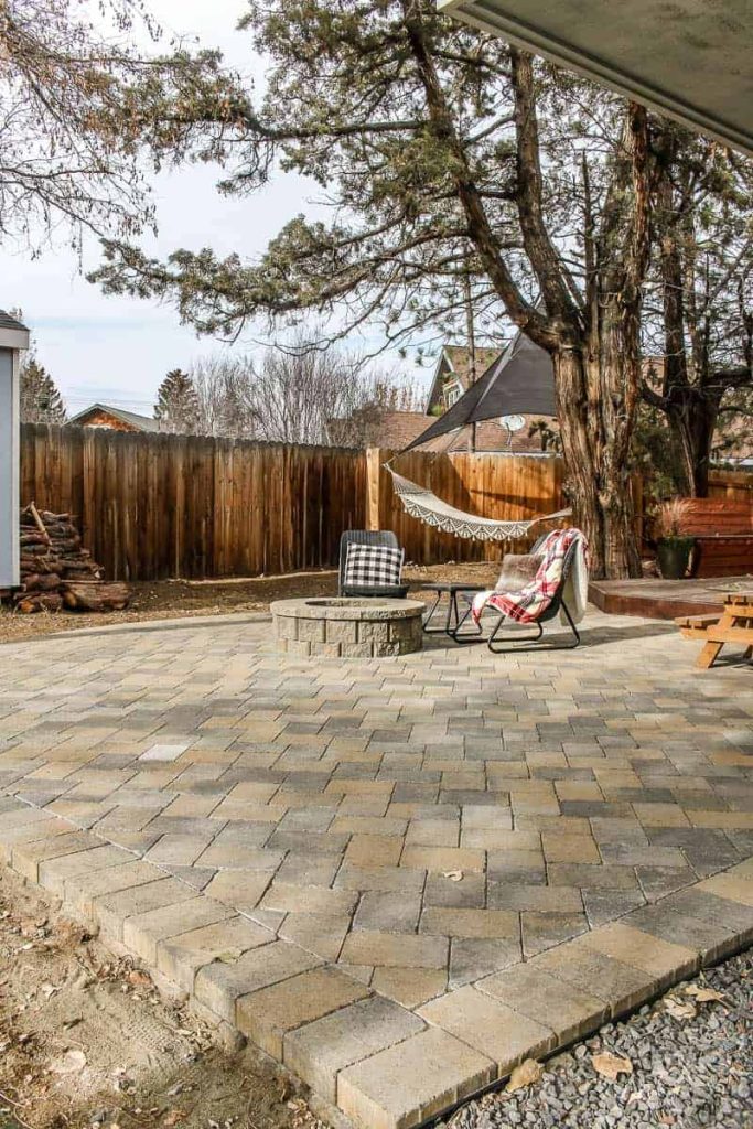 shows paver patio and fireplace 