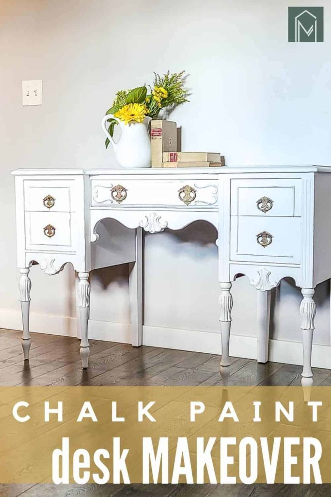 shows a full view of the white desk with flowers and books on it with overlay text that says white chalk paint desk makeover