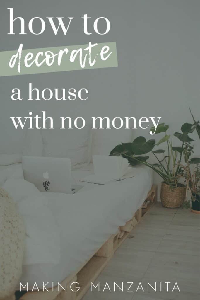Bed on floor on pallets with white bedding and plants next it and a laptop sitting on the bed with text overlay that says how to decorate a house with no money