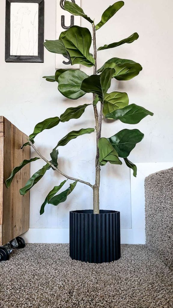 Faux fiddle leaf fig tree with black planter pot with fluted texture made with half round dowels