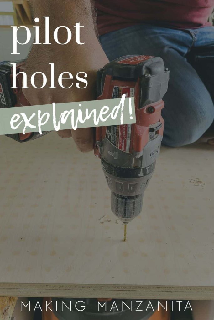 Man drilling pilot hole into sheet of plywood with drill with text overlay that says pilot holes explained