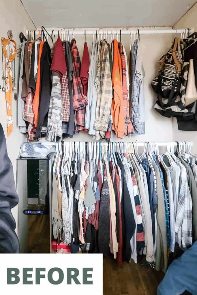 Make-shift clothing rods hold two rows of clothes in a small unfinished walk-in closet.