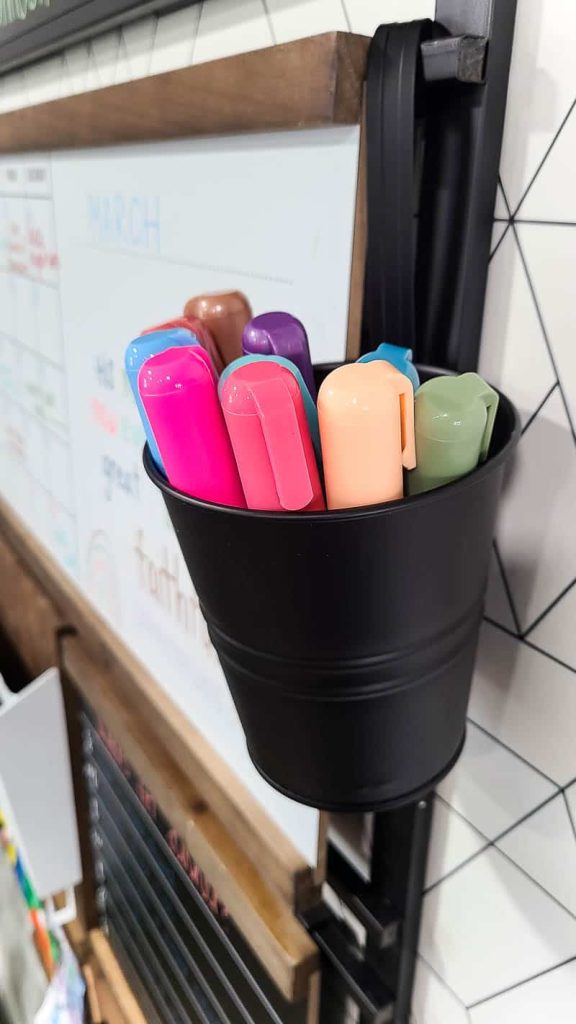 Color pins in Black tin can attached to the customizable command center