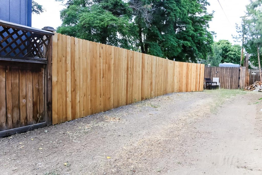 shows a wood fence in backyard
