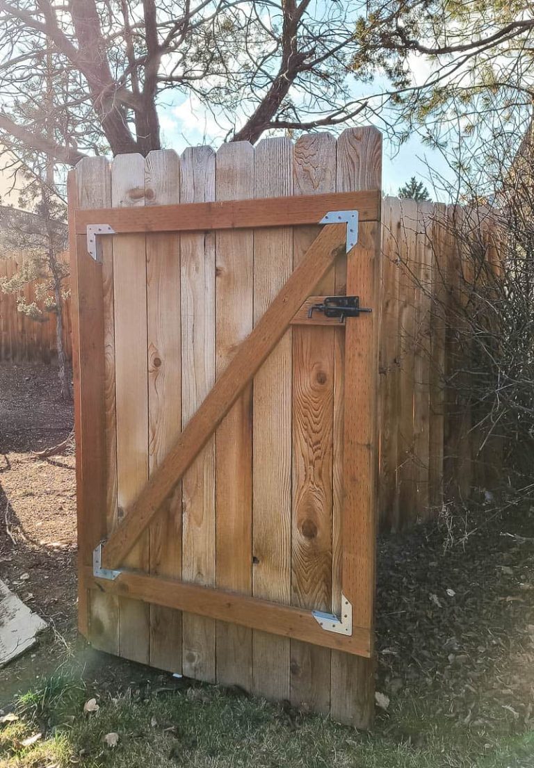 Open wooden gate in the backyard
