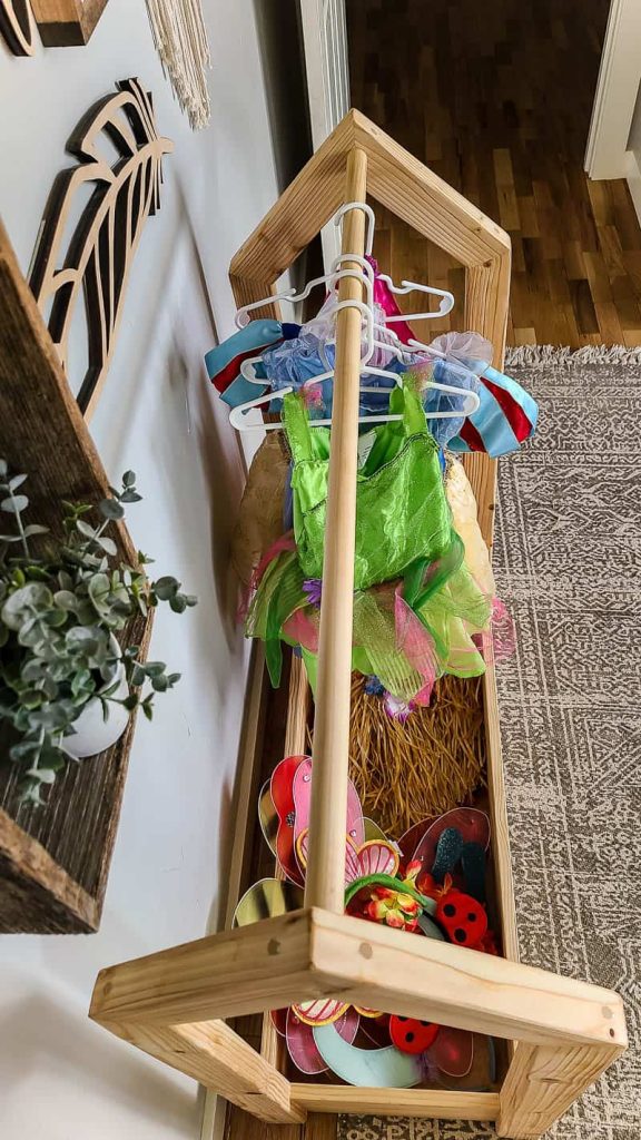 Top view of the DIY wooden dress up storage rack with costumes and accessories 