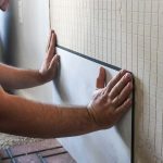 Give your fireplace an easy DIY makeover by installing these fake concrete tiles on the wall behind fireplace