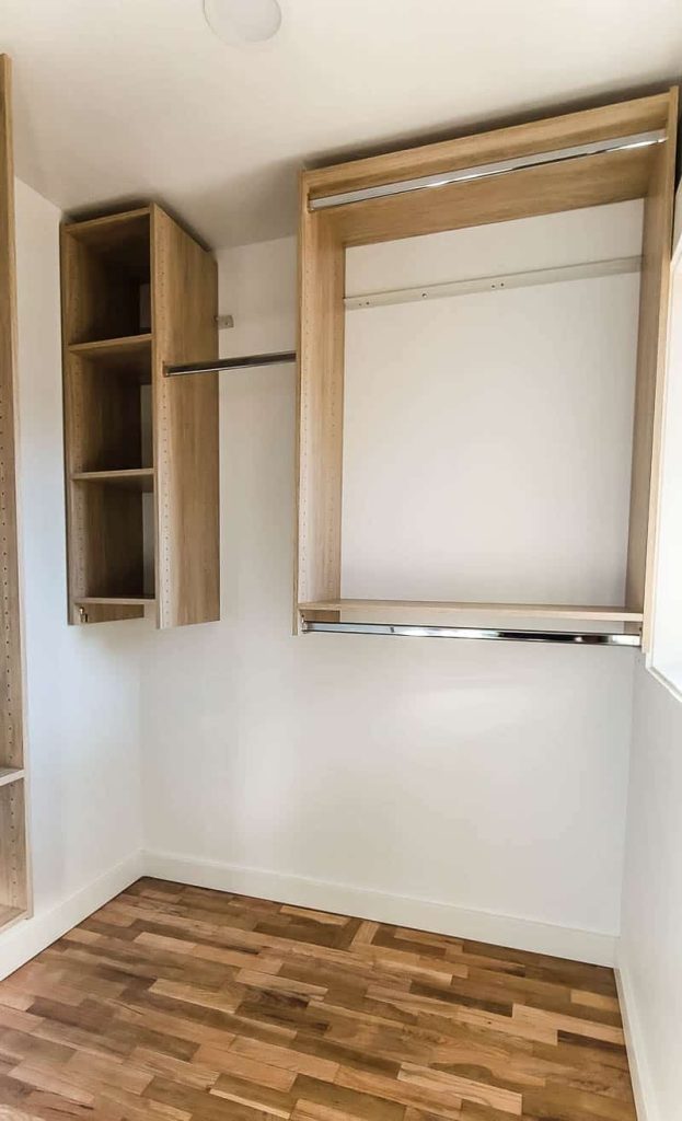 Wooden wall organization system for closet in empty closet