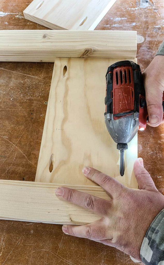 Man attaching wood edges together with pocket holes