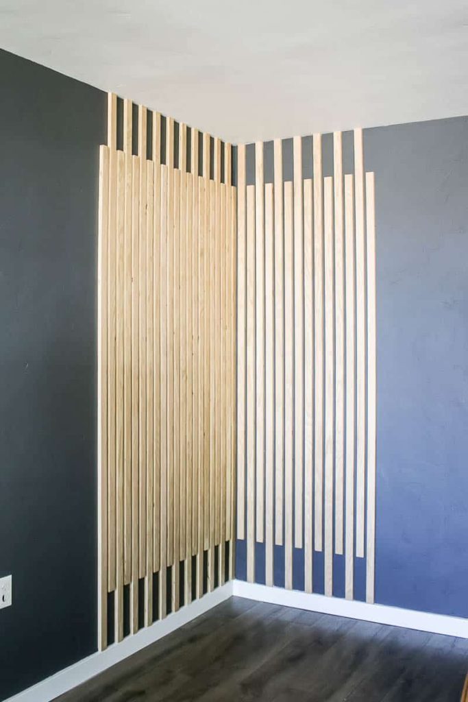 Wood slat accent wall in the corner after the makeover