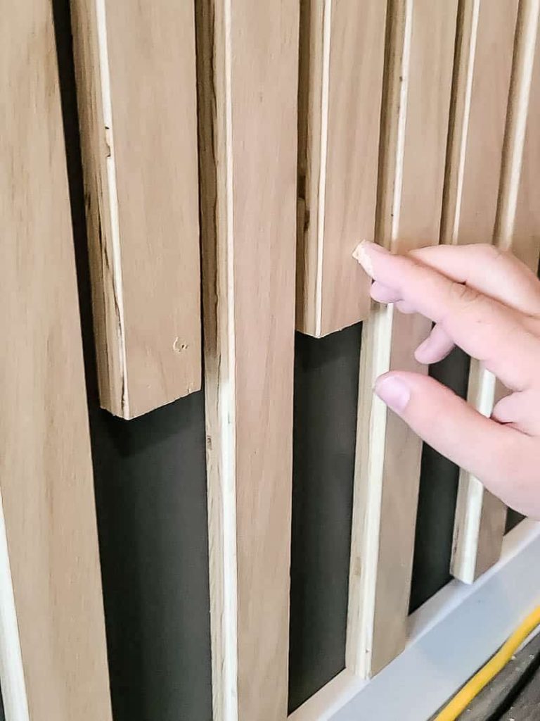 Filling nail holes on the wood slats with wood filler