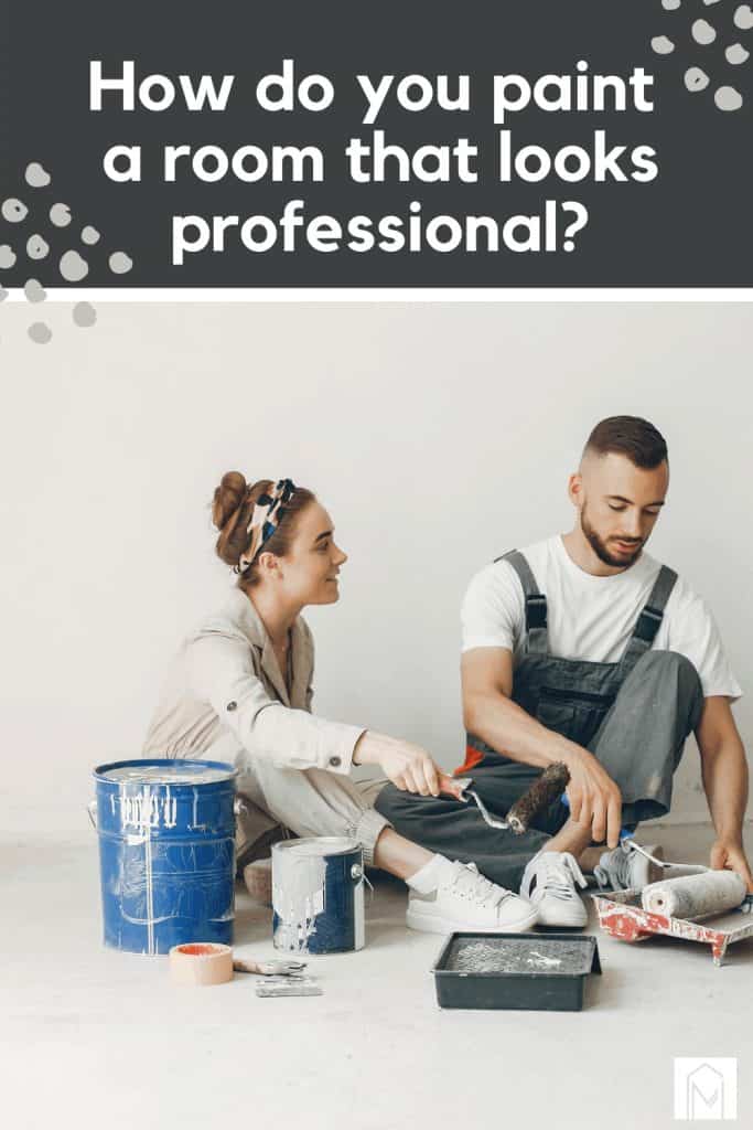 Man and woman holding roller paints and paint trays with buckets and cans of paint
