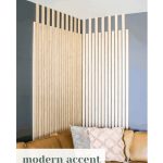 This DIY slat wall makes a big impact and was easy to create! Learn how to install a modern vertical wood slat wall in your home!