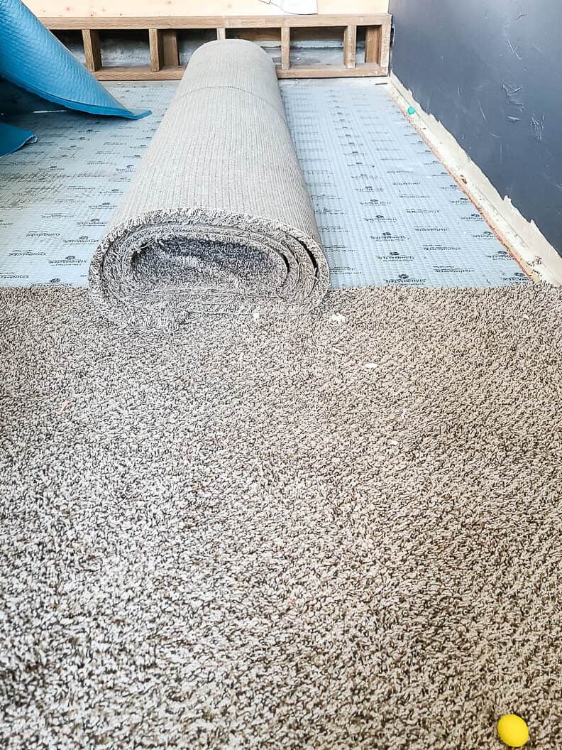 Removed and folded part of the floor carpet and half part with carpet still attached to the floor