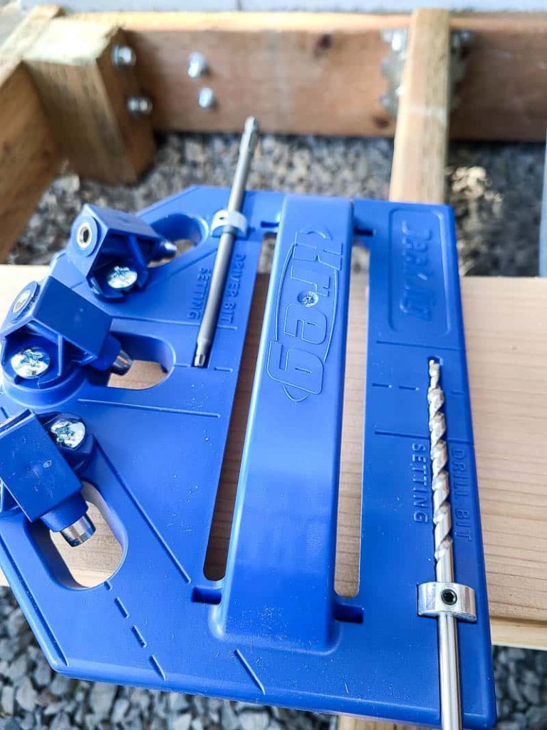 Close up of the deck jig getting the driver bit and drill bit stop collars on