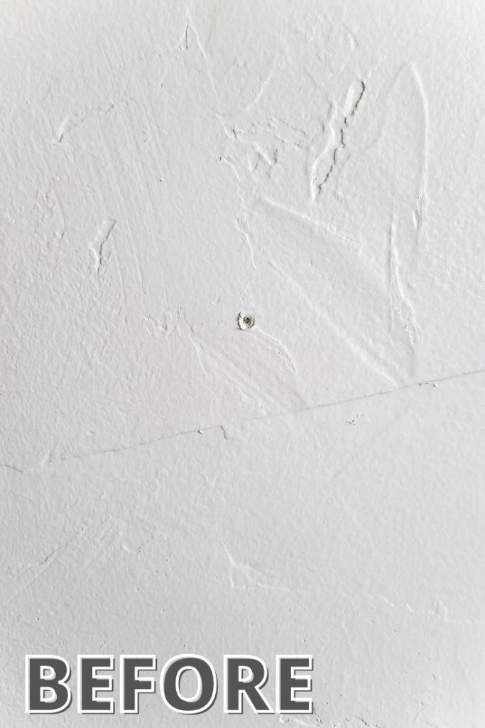 White wall with nail hole showing before image