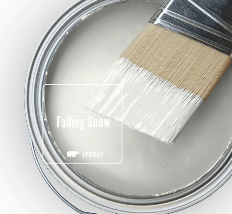 Behr falling snow paint color in can and a paint brush dipped in it