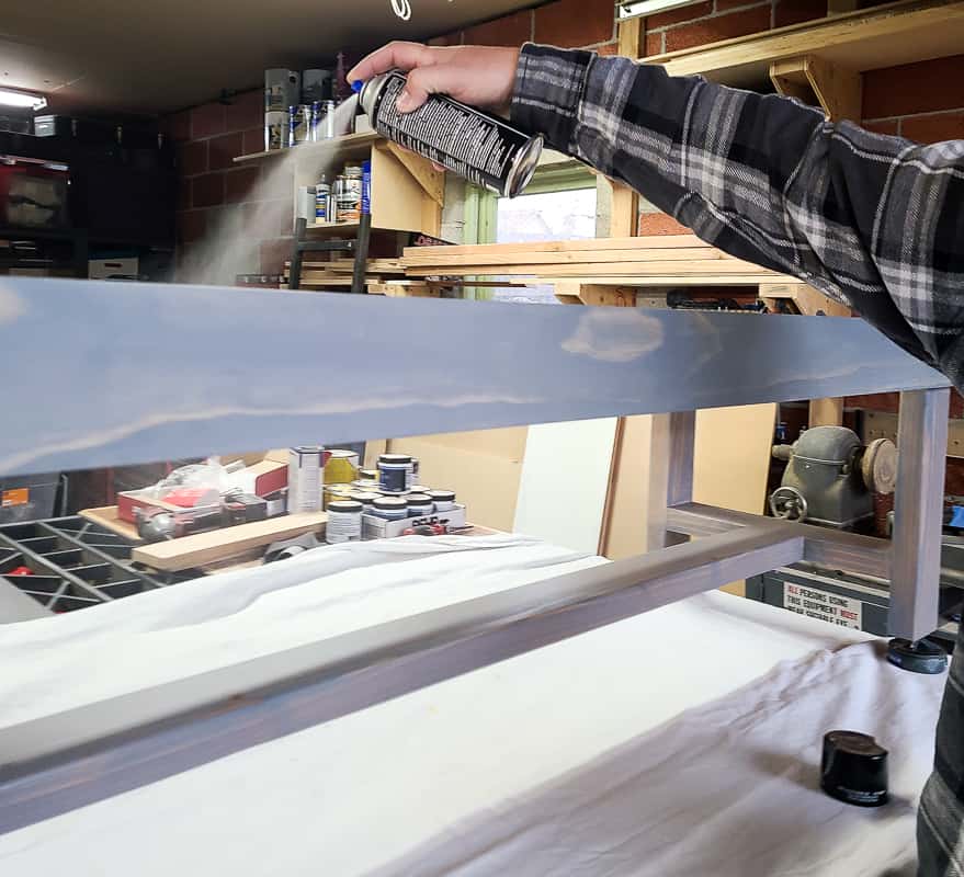 Spraying lacquer finish to frame of DIY bench.