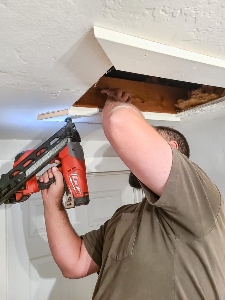 Rather than an attic door with a pull-down ladder, you simply push up on the scuttle hole cover and move it aside to access the attic space. Scuttle holes are typically used in homes where you don't need to access the attic often. 