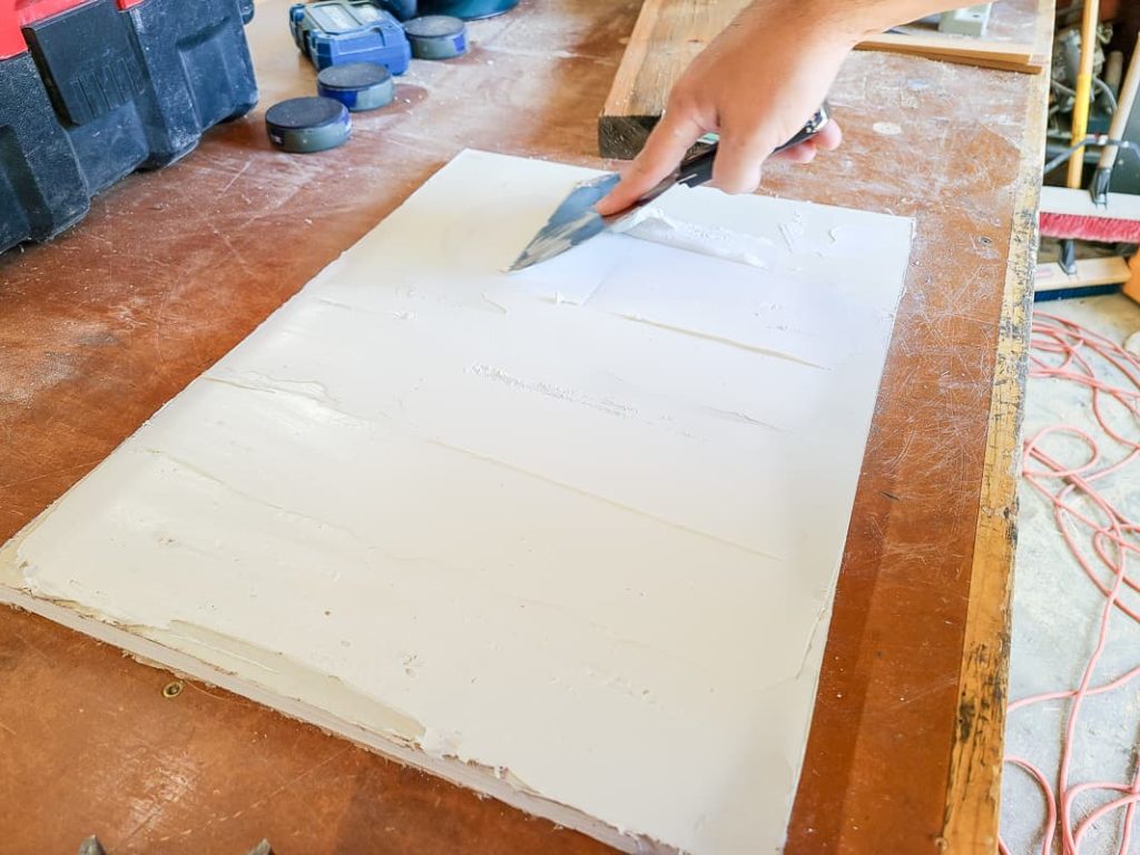 Once we knew it was the right fit, we added the joint compound to the drywall panel trying to match the skip trowel texture we have everywhere in our house.