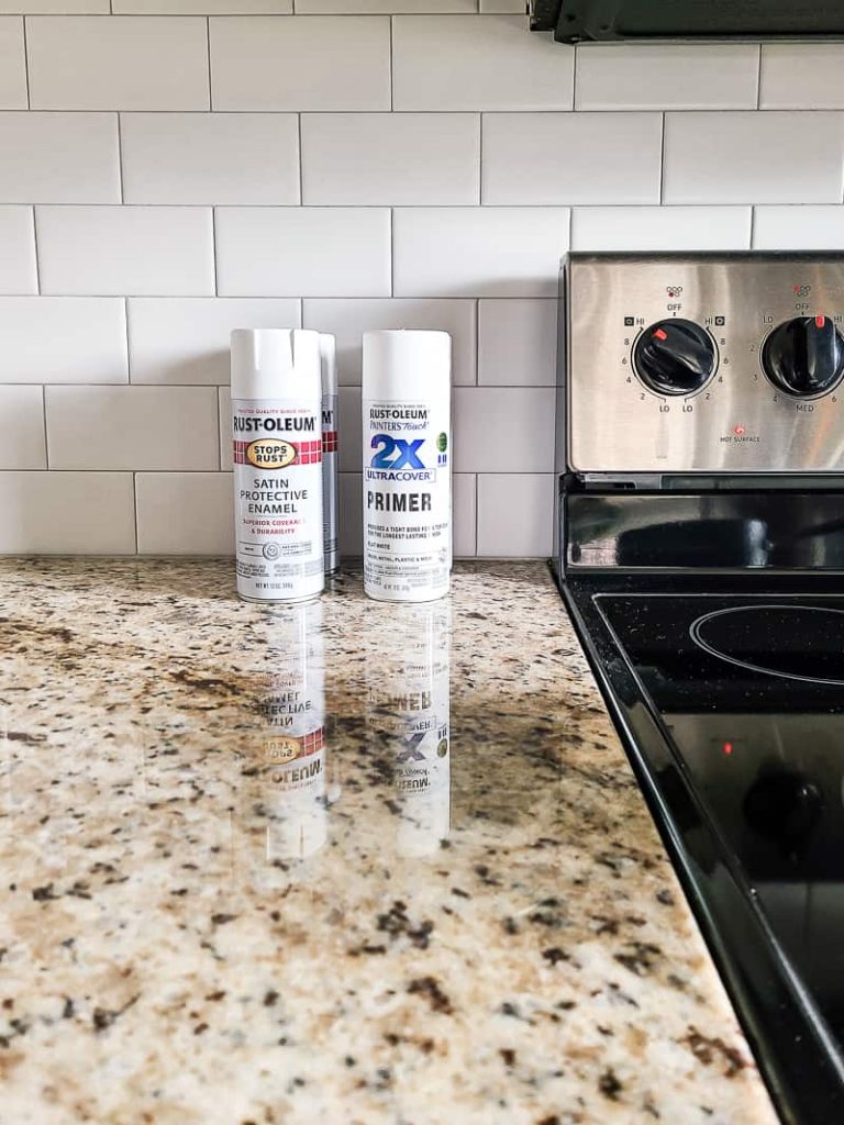 cans of spray paint on kitchen counter