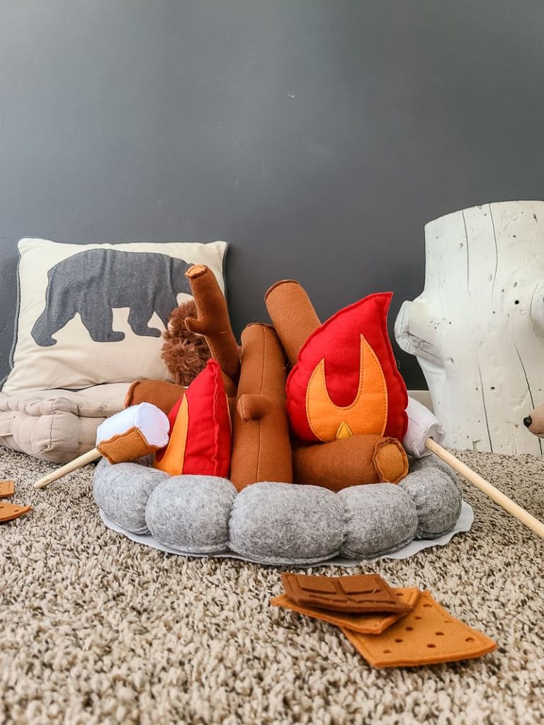 This fake campfire made with felt is so fun for kids! The camping toy set includes all of the pieces that your children need to build there pretend camp fire! The kit includes plush logs, rocks, sticks, marshmallows and felt graham crackers.