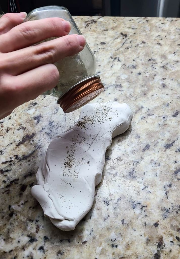 We sprinkled black pepper on white clay to add a texture that looked similar to limestone