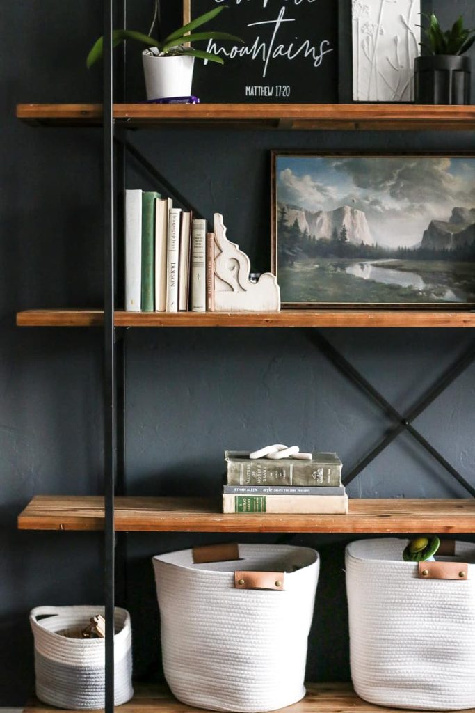 We have our living room shelves with styled with books, art, and plants with a small decorative polymer clay knot as a paperweight