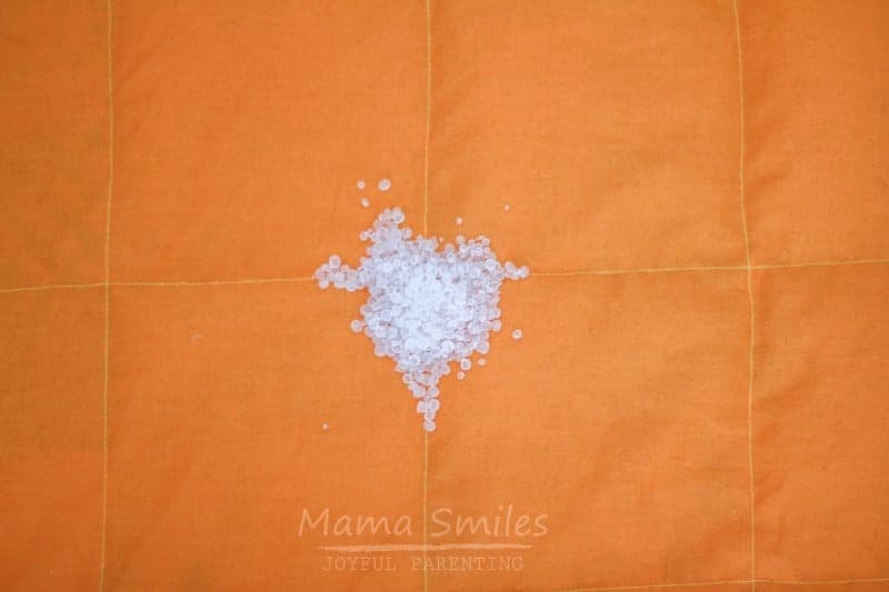 image of weighted blanket filling on orange fabric
