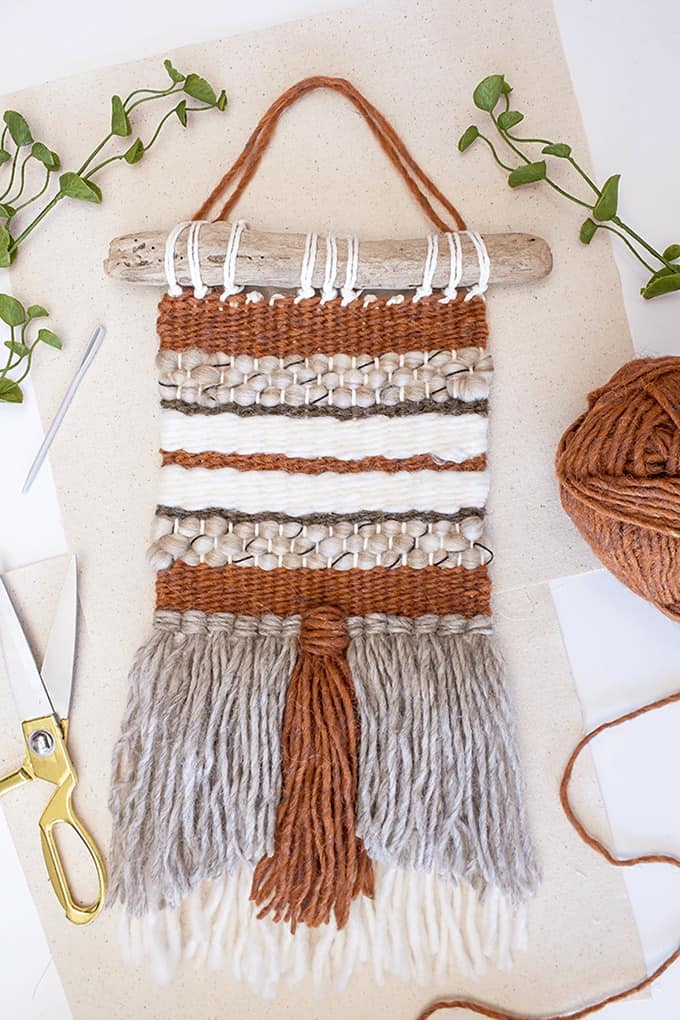 woven wall hanging using brown, white and gray yarn