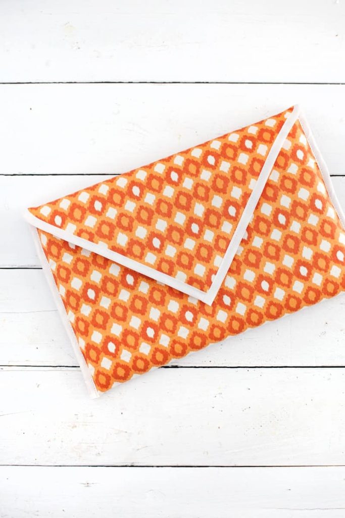 Orange patterned quilted laptop sleeve