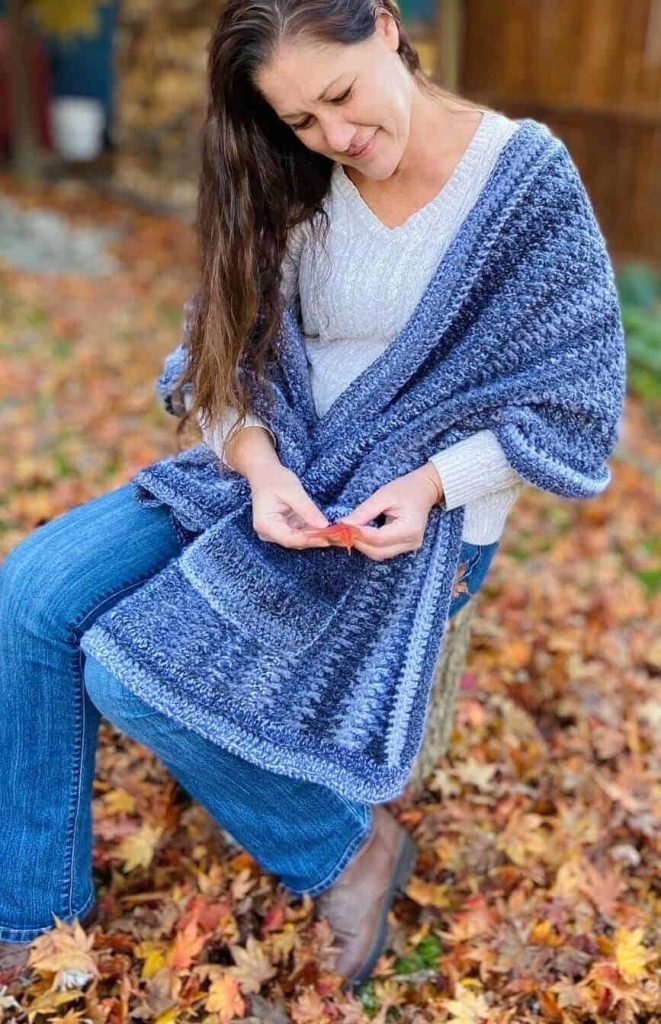 lady wearing a blue crochet shawl