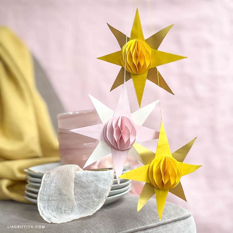 Yellow and pink honeycomb suns made from paper