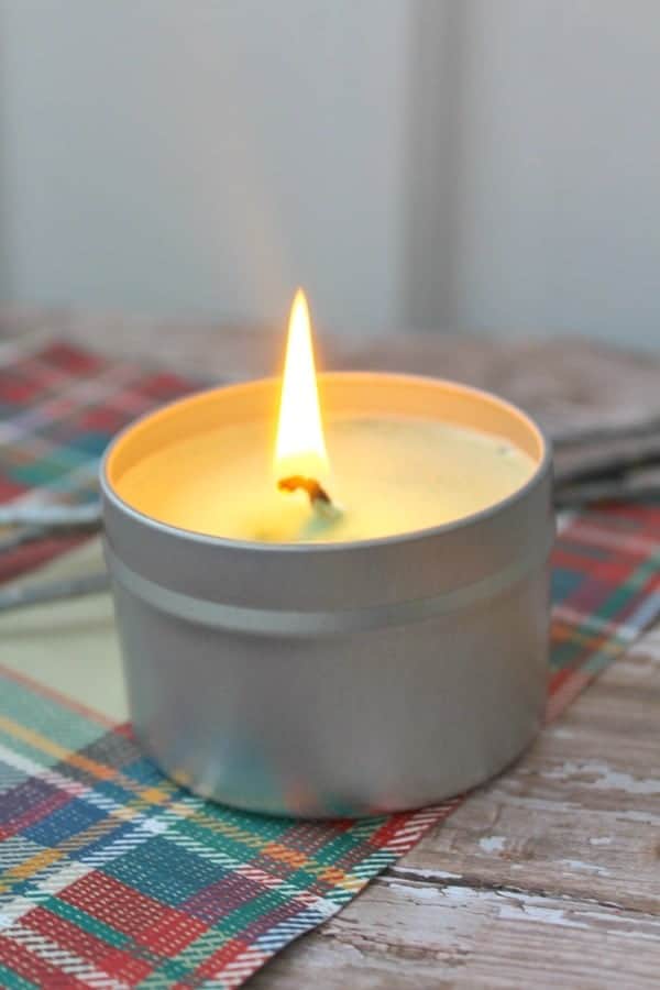 burning candle in tin