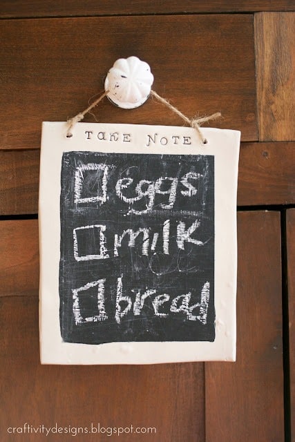 Chalkboard made with polymer clay with grocery list written on it