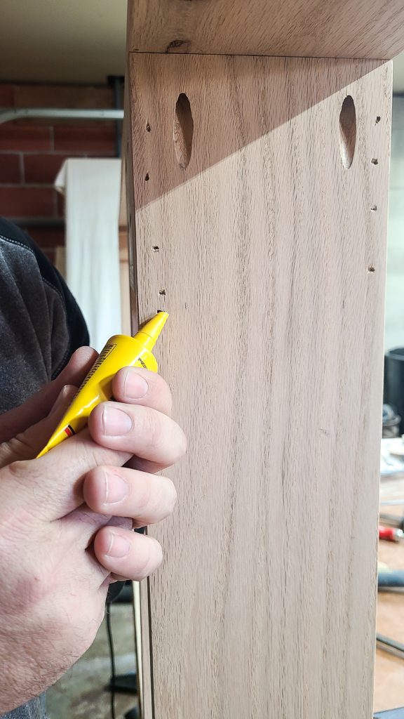 The person is filling the holes.
